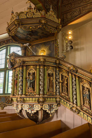 Tornio, Finland - June 2012: Painted wood carvings decorate the centuries old pulpit. The style is late Renaissance or early Baroch. The local Mr. Niilo Jaakonpoika Fluur created the pulpit in the late 17th century.のeditorial素材