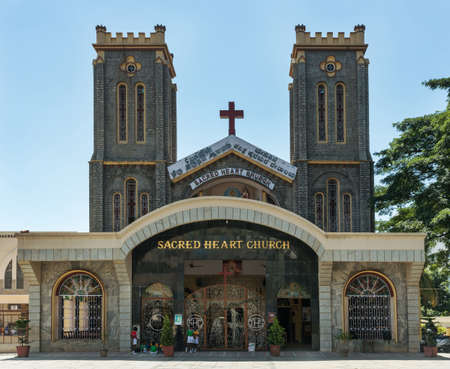 BANGALORE, INDIA - CIRCA OCTOBER 2013  a few school kids gather in front of the entrance to the Sacred Heart church のeditorial素材