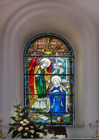 Stained glass window depicting Angel Gabriel bringing the message to Mary of her becoming the mother of Jesus, at the Anglican Saint Mark s Cathedral in Bangalore のeditorial素材