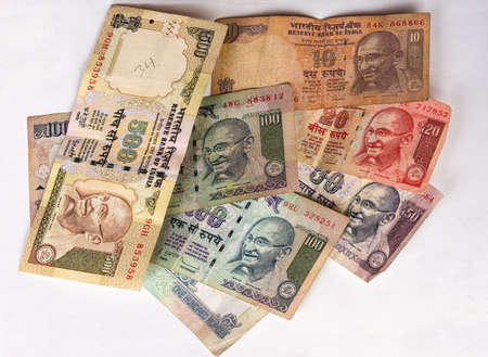 This collection of rupee notes consists of seven different notes, each with a different value and...