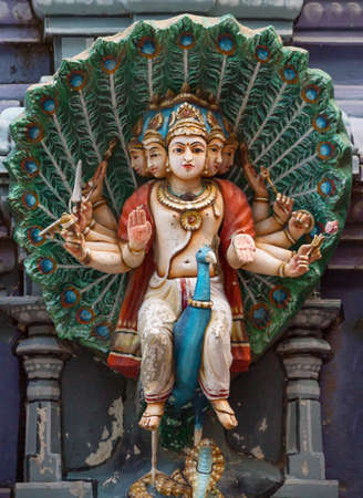 Murugan on his peacock mount statue on Gopuram at Rathinagiri Hill Temple in Tamil Nadu, India 