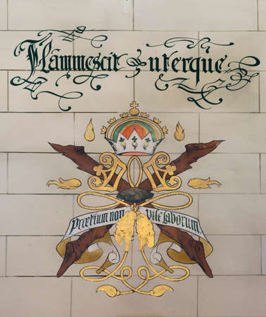 GENT, BELGIUM - CIRCA MARCH 2014: Coat of Arms at Ghent Belfry. The slogan reads in Latin they both...