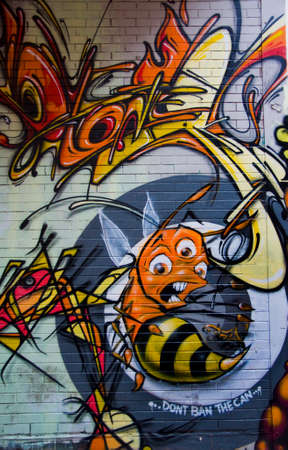 MELBOURNE, AUSTRALIA - CIRCA NOVEMBER 2009  Colorful graffiti in back alley of downtown, depicts a bunch of scary looking figures and a three-eyed angry honey bee のeditorial素材