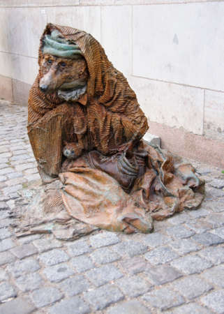 STOCKHOLM, SWEDEN - CIRCA SEPTEMBER 2010: Statue of begging bear on the sidewalk near the Opera along the waterfront in Stockholm.のeditorial素材