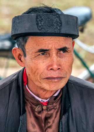 Chua Bai Dinh Pagoda, Vietnam - March 14, 2012: Closeup of man wearing thick band with Buddhist symbol at the Buddhist temple.のeditorial素材