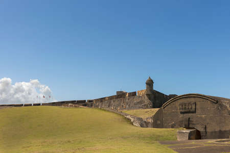 SAN JUAN, PUERTO RICO - MARCH 6, 2015: Castillo San Christobal. Wide view on Northeastern lookout tower on rampart with flags and bunker.のeditorial素材