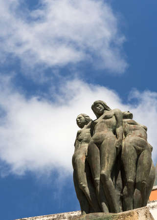 SAN JUAN, PUERTO RICO - MARCH 8, 2015: Part of the La fuente la Herencia de las Americas statue group. Naked female bodies against a blue sky with a few white clouds.のeditorial素材