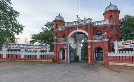Chettinad, India - October 15, 2013: British style, red gate to Old mansion of the deposed maharajah. This is now the government building that houses the local tax collectors. Pudukkottai.のeditorial素材