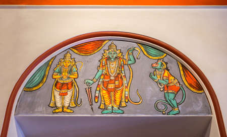 Chettinad, India - October 17, 2013: Chidambara Palace in Kadiapatti. Wall painting above door showing Vishnu as Rama, Hamuman and Lakshmana.のeditorial素材