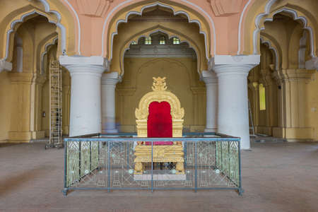 Madurai, India - October 21, 2013: Copy of the golden throne of the Nayak at main audience hall of his palace. Fence shields throne from public.のeditorial素材