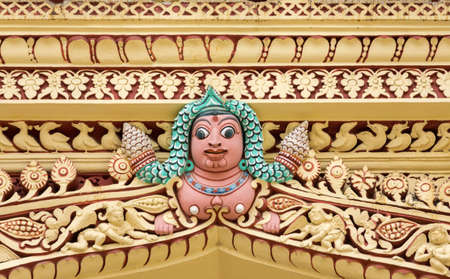 Madurai, India - October 21, 2013: At the Nayak Palace, a human torso with long, green hair hidden between abundant decorations form the upper plinth.のeditorial素材