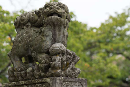 Kanazawa, Japan - September 22, 2016: Old stone Japanese Lion-monster statue at Kenrokuen Garden...