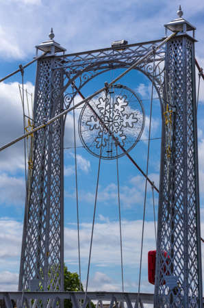 Inverness, Scotland - June 1, 2012: Snowflake design on gray metallic support pillars of Greig...