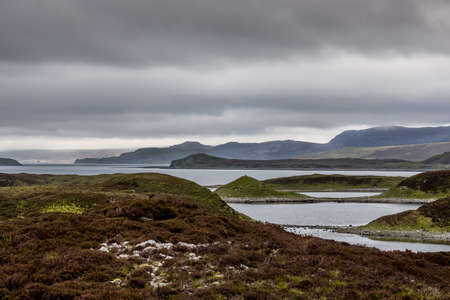 North Coast, Scotland - June 6, 2012: Irregularly shaped, gray-water Loch Eriboll under dark cloudy...