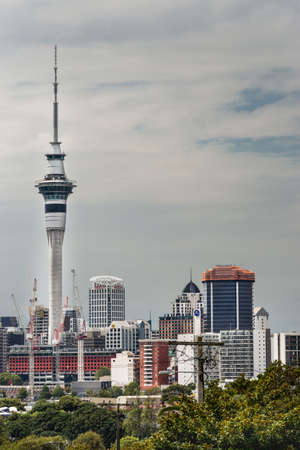 Auckland, New Zealand - March 1, 2017: From the higher lying Ponsonby Road, the Sky Tower can be seen clearly towering over the rest of the skyline. White clouds in blue sky.のeditorial素材
