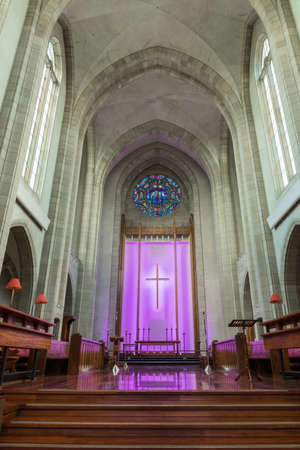 Auckland, New Zealand - March 4, 2017: Chancel at old part of Holy Trinity Cathedral features wooden...