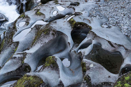 Fiordland National Park, New Zealand - March 16, 2017: closeup of weird rocks polished and worn out by streaming water at the deep Chasm.のeditorial素材