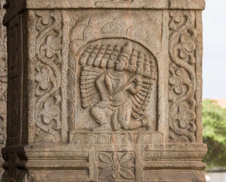 Nanjangud, India - October 26, 2013: Closeup of chiseled mural of Lord Ravana with his ten heads  in beige sandstone of the Mandapam at Srikanteshwara Temple.のeditorial素材