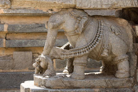 Mysore, India - October 27, 2013: Closeup of brown stone elephant statue supporting part of the Trikuta shrine at Chennakesava Temple in Somanathpur.のeditorial素材