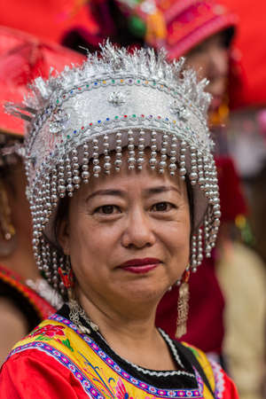 Sydney, Australia - March 25, 2017: Head shot of Chinese woman living in Australia welcomes Chinese Premier Li Kequing with traditional dances, songs and music. Public square side of Town Hall.のeditorial素材