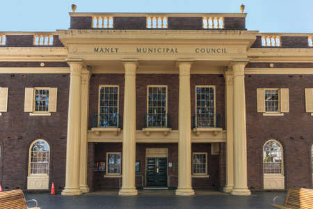Sydney, Australia - March 26, 2017: Front facade of brown and yellow historic building housing Manly Municipal Council meetings.のeditorial素材