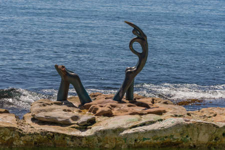 Sydney, Australia - March 26, 2017: Closeup of Oceanides statue on rock in Tasman Sea in front of Manly beach by Helen Leele.のeditorial素材