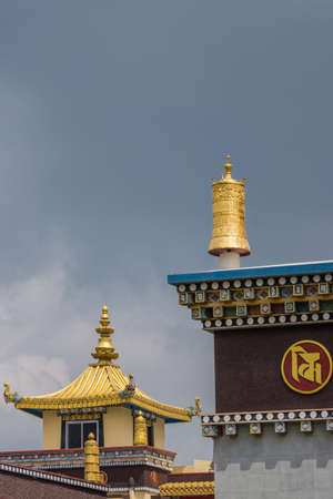 Coorg, India - October 29, 2013:Golden turret as decoration on cormer of roof at Zangdog Palri temple at Namdroling Buddhist Monastery. Designs and cubes. Extra golden tower.のeditorial素材
