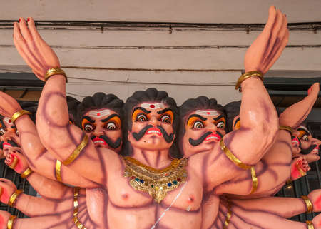 Madikeri, India - October 31, 2013: Closeup of Lord Ravana torso procession dolls, on display at Madikeri Fort. Multicolored decorations. Multiple heads and arms.のeditorial素材