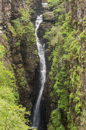 Braemore, Scotland - June 8, 2012: Closeup of waterfall of Corrieshalloch Gorge, a deep cut in landscape with forested vertical slopes.のeditorial素材