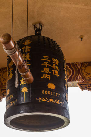 Hacienda Heights, CA, USA - March 23, 2018: Close up of giant ceremonial bell hinging in front of...