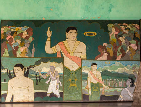 Shravanabelagola, Karnataka, India - November 1, 2013: Bhandar Basadi temple complex. Metal plate painting of one standing male preaching, with onlookers. Pastel colors spoiled with rust spots.のeditorial素材