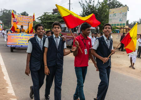 Mellahalli, Karnataka, India - November 1, 2013: Karnataka Rajyotsava Parade. Four teenaged school...