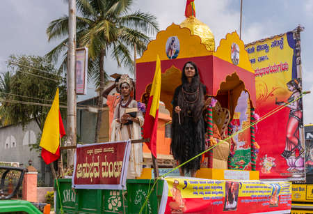 Mellahalli, Karnataka, India - November 1, 2013: Karnataka Rajyotsava Parade. The woman in black...