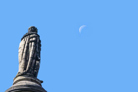 Edinburgh, Scotland, UK - June 13, 2012: Closeup of statue of Henri Dundas on top of Melville monument looking at the moon in a blue sky.のeditorial素材
