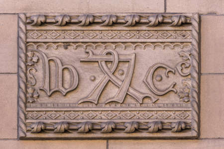 Edinburgh, Scotland, UK - June 13, 2012: Mystery symbols or runes as mural on beige-brown  front facade of Central Library.のeditorial素材