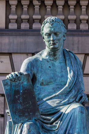 Edinburgh, Scotland, UK - June 13, 2012; Closeup of David Hume green bronze statue outside Court...