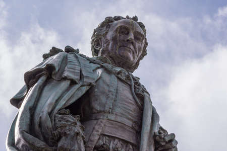 Edinburgh, Scotland, UK - June 14, 2012; Fish eye shot on chest and head of Statue of Walter Montagu Douglas Scott, Duke of Buccleuch on Parliament Square. cloudscape.のeditorial素材
