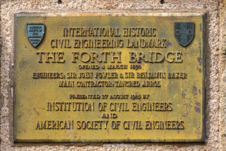 Queensferry, Scotland, UK - June 14, 2012: Yellowish historic metal plate announcing the opening of...