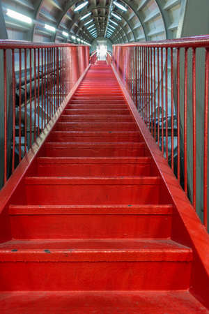 Brussels, Belgium - September 25, 2018: Red endless-like stairway to nowhere or heaven through one tube of Atomium Momument.のeditorial素材