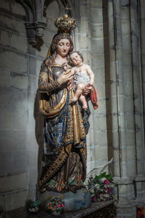 Brussels, Belgium - September 26, 2018: Madonna statue at Cathedral of Saint Michael and Saint Gudula. Gray stone background.のeditorial素材