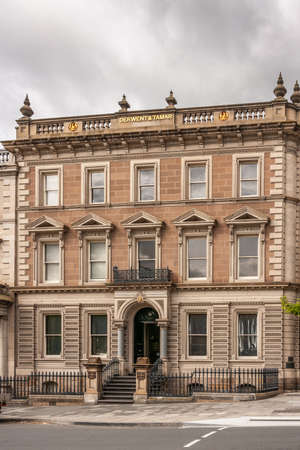 Hobart, Tasmania, Australia - December 14, 2009:  closeup and frontal view of historic building, the law offices of Derwent and Tamar under heavy gray sky.のeditorial素材