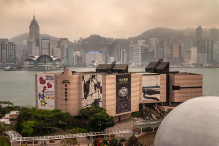 Hong Kong Island, China  - May 12, 2010: Convention Center and Central Plaza Tower with Hong Kong Museum of Art building  and sphere of Space museum in front. Victoria Harbour in betweenのeditorial素材