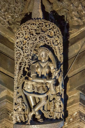 Belur, Karnataka, India - November 2, 2013: Chennakeshava Temple building. Black stone statue of...