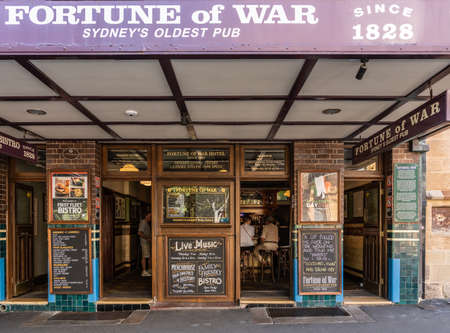 Sydney, Australia - February 11, 2019: Facade with look inside the Fortune of War, oldest pub in town in George Street near Circular Bay. Chalkboards with advertisements for drinks.のeditorial素材