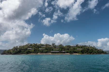 Hamilton Island, Australia - February 16, 2019: Upscale Qualia Beacht Resort and Villas with private beach, built on green hill overlooking the coral sea.のeditorial素材