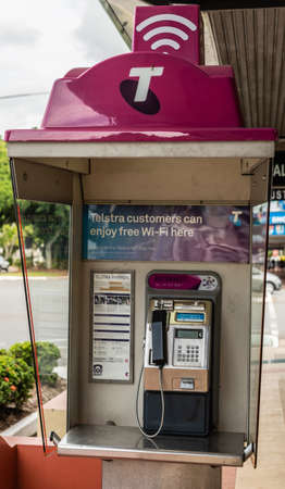 Cairns, Australia - February 17, 2019: Closeup of Telstra Public payphone with free wifi hotspot on Abbott Street.のeditorial素材