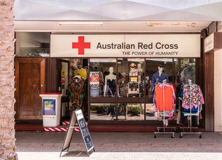 Darwin Australia - February 22, 2019: Australian Red Cross merchandise shop downtown displays clothing and other stuff in window.のeditorial素材