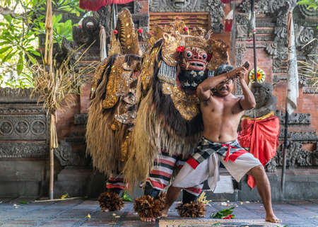 Banjar Gelulung, Bali, Indonesia - February 26, 2019: Mas Village. Play on stage setting. Monsters in elaborate garments and with golden masks stop suicidal knight.のeditorial素材