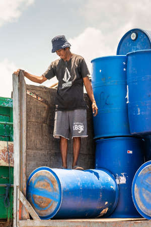 Makassar, Sulawesi, Indonesia - February 28, 2019: Paotere Old Port. Closeup of dock worker standing...