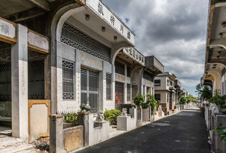 Manila, Philippines - March 5, 2019: Chinese Cemetery in Santa Cruz part of town. Street of tombs built as houses under heavy cloudscape.のeditorial素材